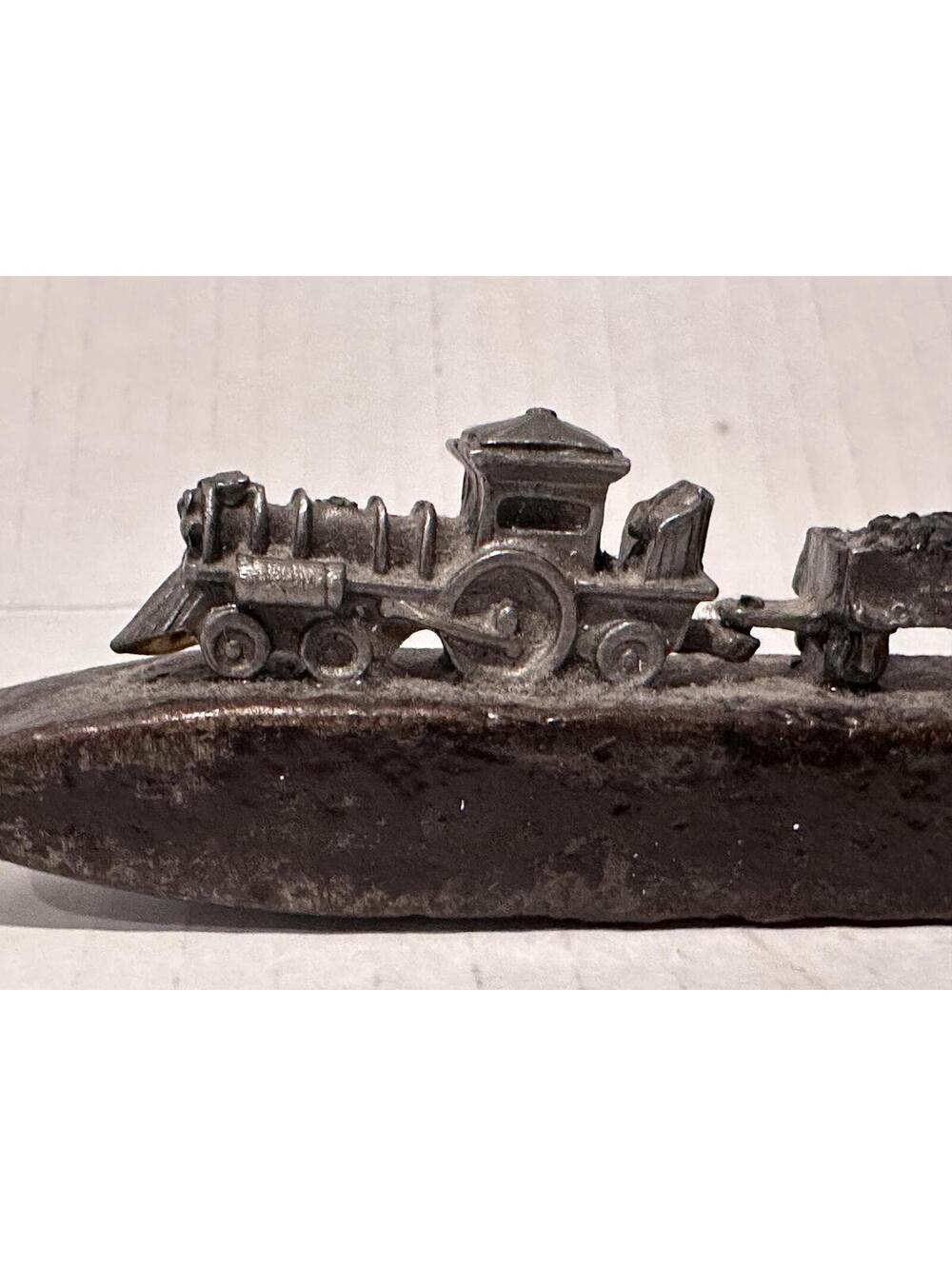 Vintage Railroad Spike Art Sculpture featuring a Pewter Metal Train